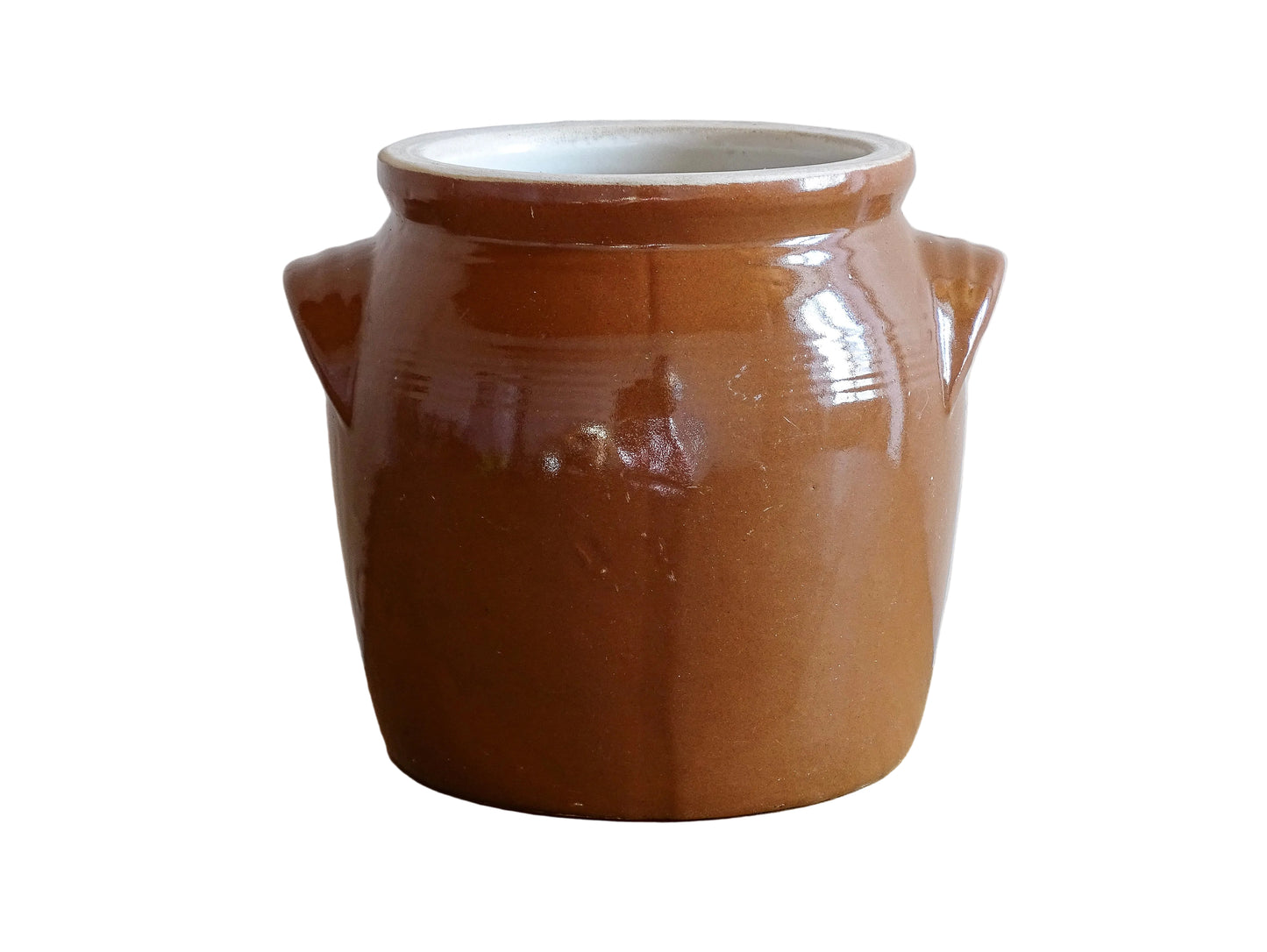 French antique stoneware preserving jar with a brown glaze. This pottery cache pot dates to the early 20th century and has a high gloss glaze.