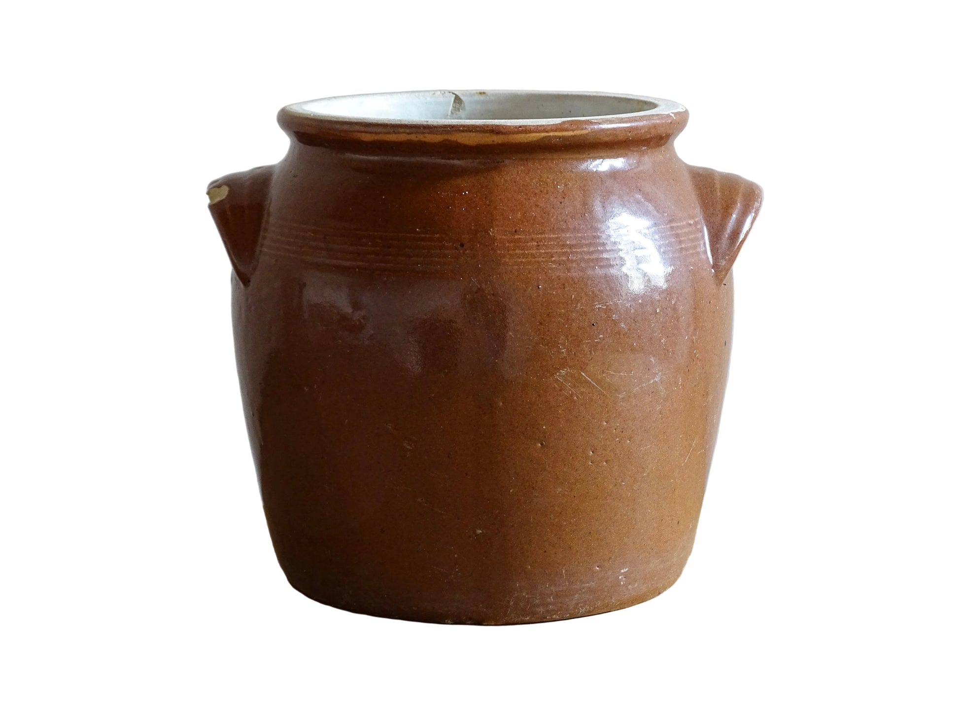French antique stoneware preserving jar with a brown glaze. This pottery cache pot dates to the early 20th century and has a high gloss glaze. 