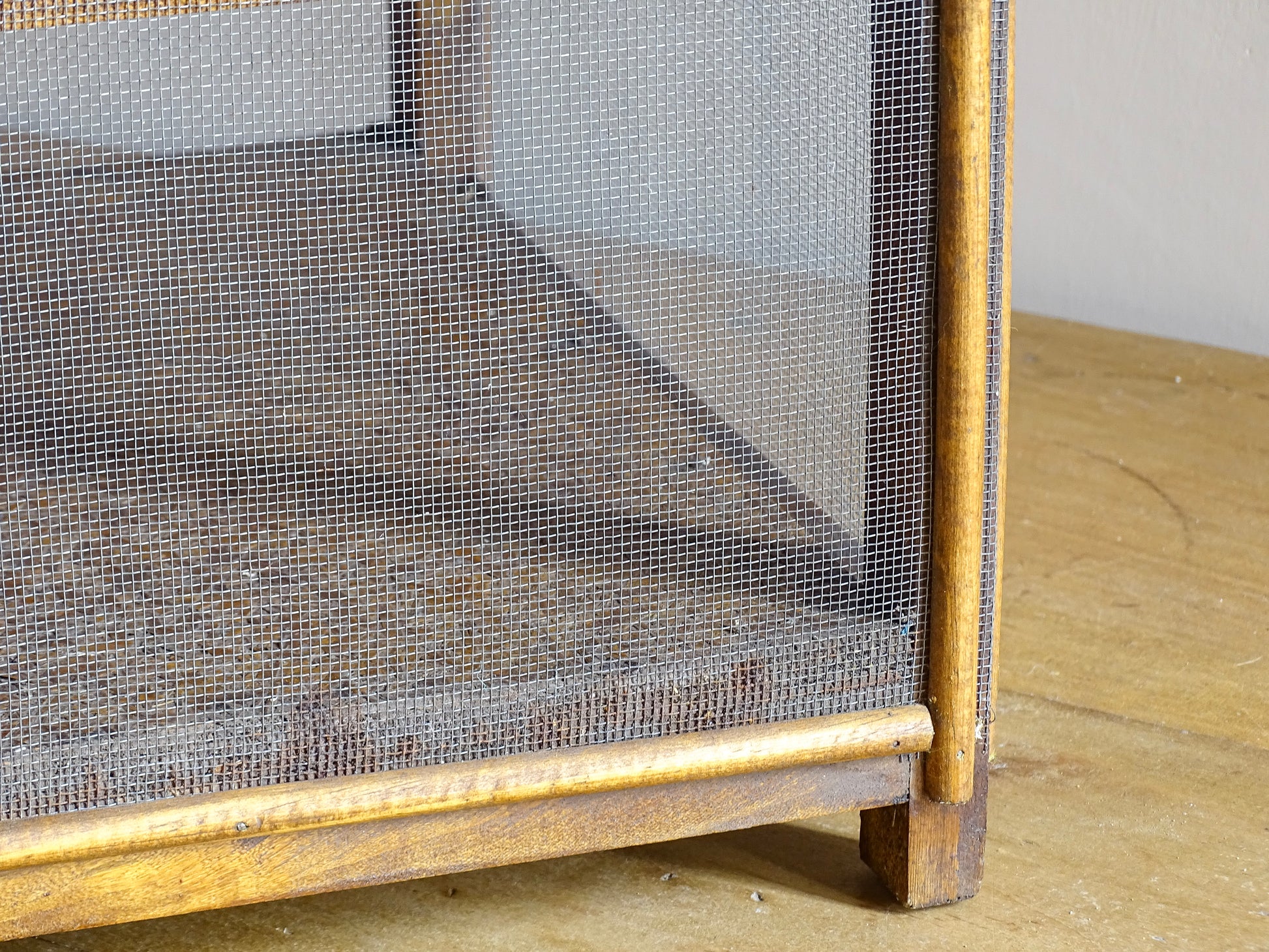 A French antique garde manger or countertop pantry cabinet. Circa 1920. This antique wooden garde manger with wire mesh panels on all sides was traditionally used for storing cheese, fruit, and baked goods while allowing air to circulate.