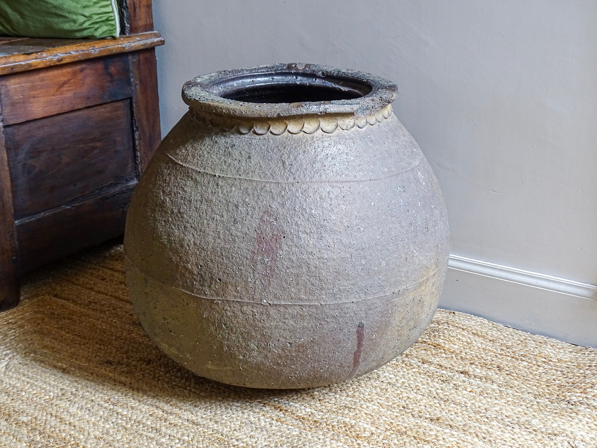 Early 19th century French terracotta pot or ponne from South West France, large rustic antique clay vessel with rounded form displayed in an interior setting.