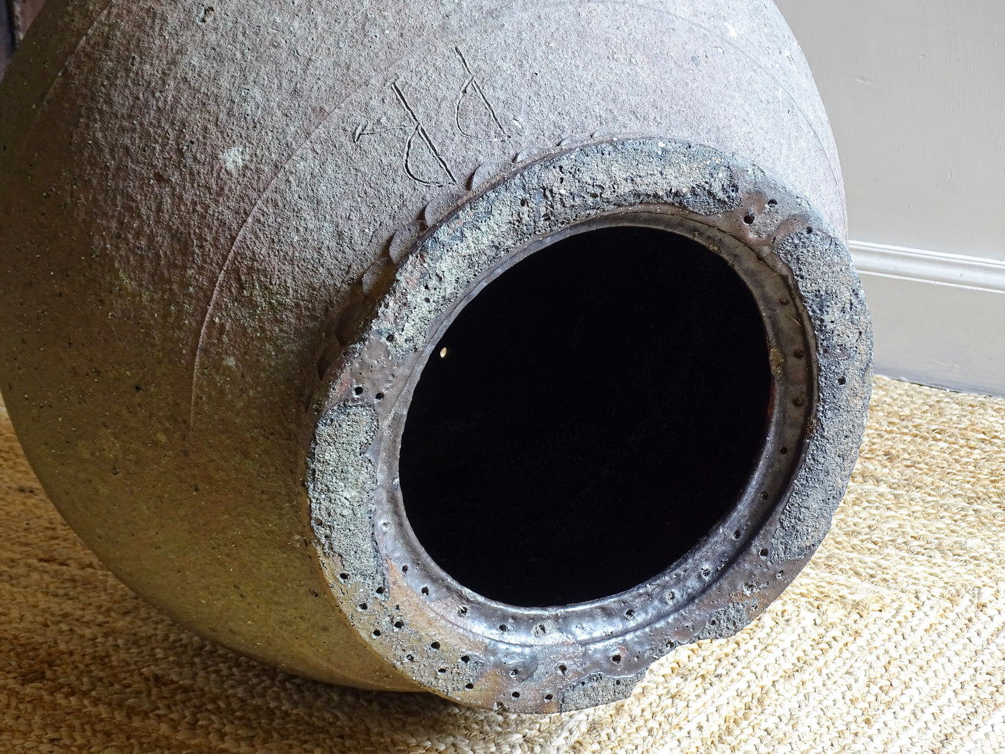 Interior view of early 19th century French terracotta pot (ponne) showing original glaze and hand-formed rim detail from South West France.