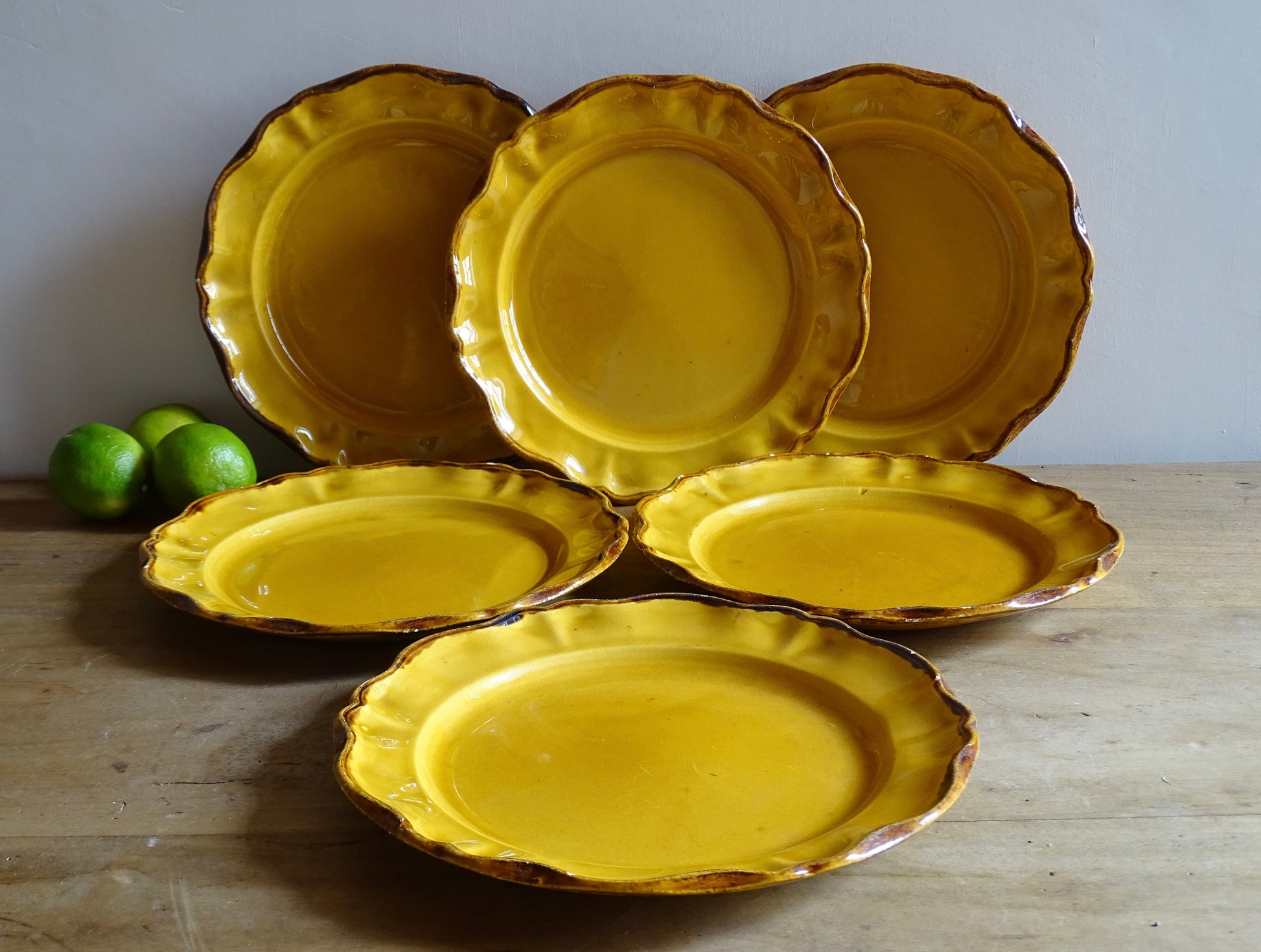 Beautiful set of six French vintage ceramic plates by ADP (Atelier de la Provence) glazed in a rich yellow ochre with scalloped rims. The beautiful colour brings warmth to a table setting. 