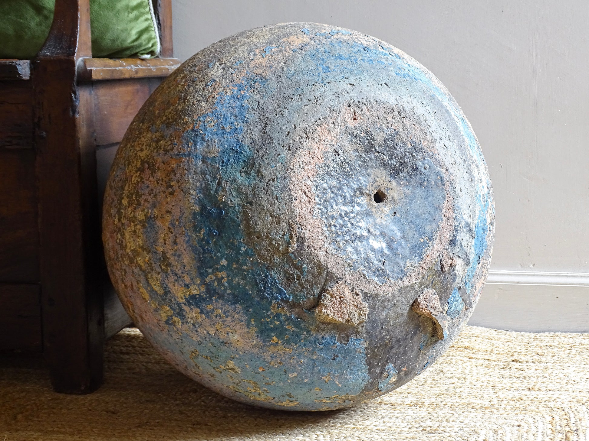 A large, early 19th century French antique terracotta pot, known as a ponne (salting pot), sourced in the Bordeaux region and likely Charentais in origin. This example has a beautifully rounded, generous form with a rolled rim. The surface is particularly special, showing layers of time, wear and historic pigment. Traces of faded blue and earthy tones remain across the body, creating a richly textured patina. 