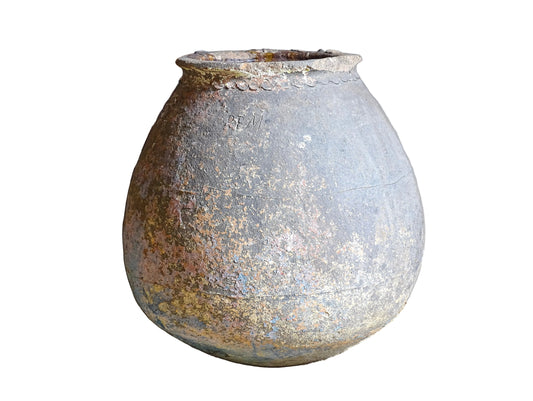 A large, early 19th century French antique terracotta pot, known as a ponne (salting pot), sourced in the Bordeaux region and likely Charentais in origin. This example has a beautifully rounded, generous form with a rolled rim. The surface is particularly special, showing layers of time, wear and historic pigment. Traces of faded blue and earthy tones remain across the body, creating a richly textured patina. 