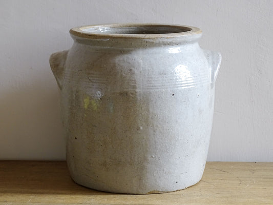French antique ceramic jar with a grey beige glaze. Preserving pot or confit pot for a country farmhouse kitchen.