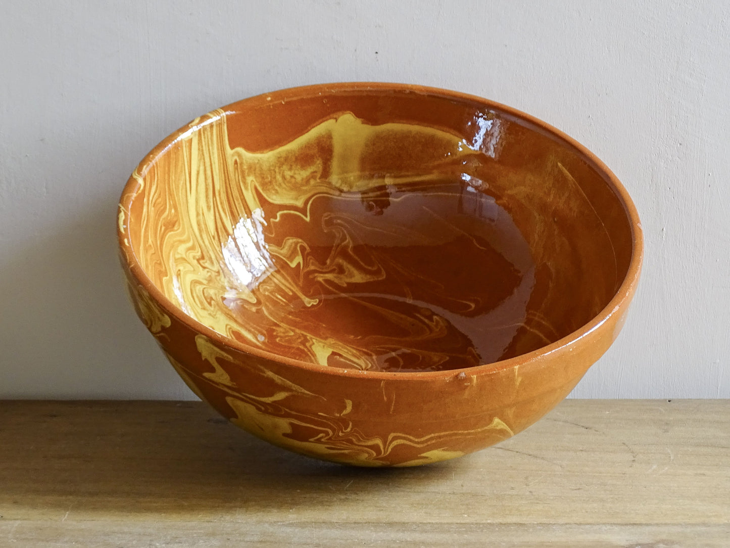 Rustic French terracotta bowl with marbled jaspe glaze and glossy interior
