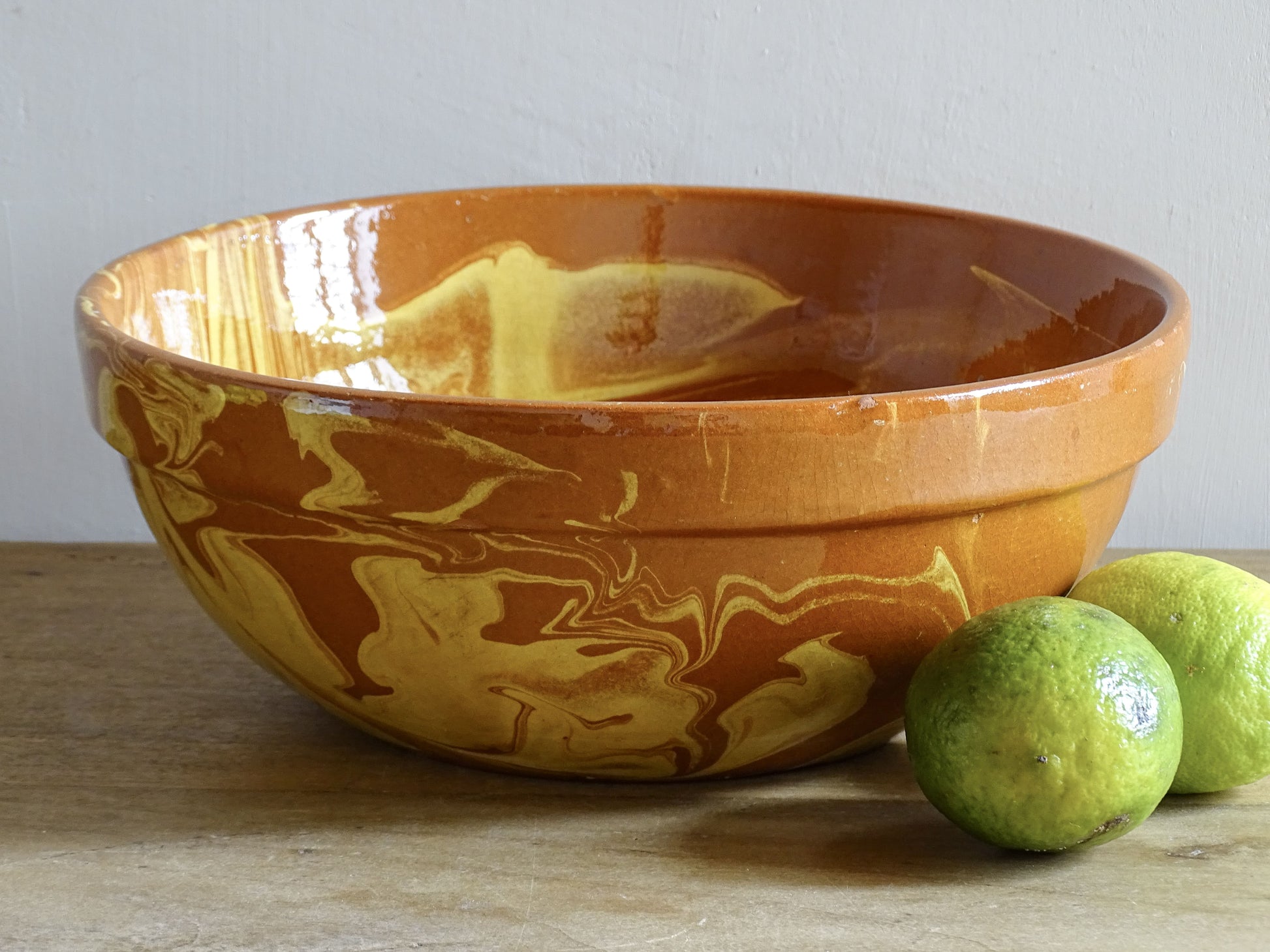 French antique terracotta bowl with jaspe marbled glaze in warm ochre and brown tones