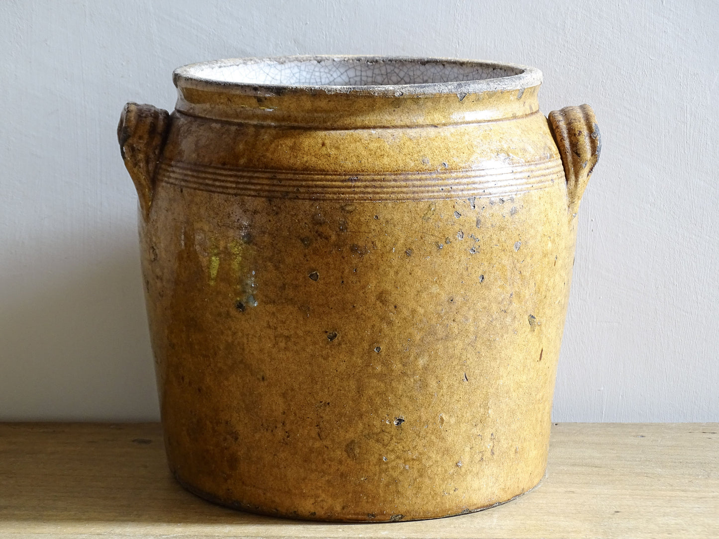 French antique ceramic pot or stoneware confit jar with brown glaze and rich patina.