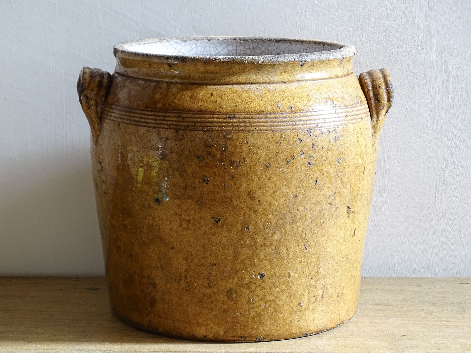 French antique ceramic pot or stoneware confit jar with brown glaze and rich patina.