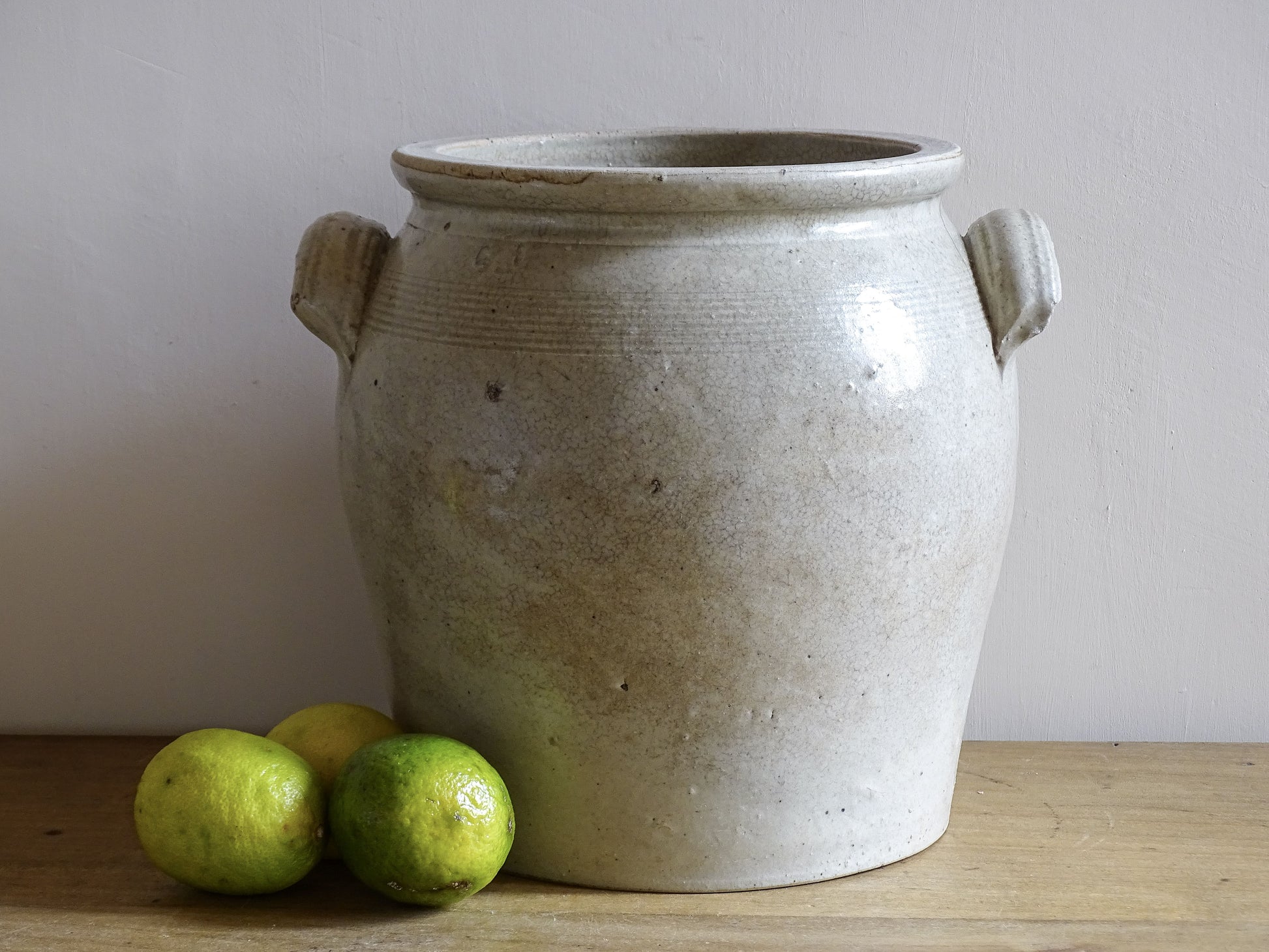 French antique stoneware jar or confit pot with a grey beige glaze.