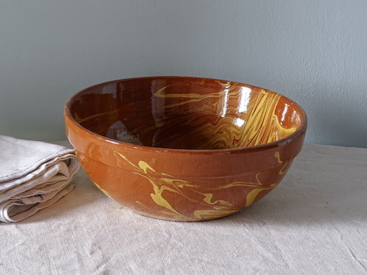 French antique ceramic bowl with an orange and yellow jaspe glaze