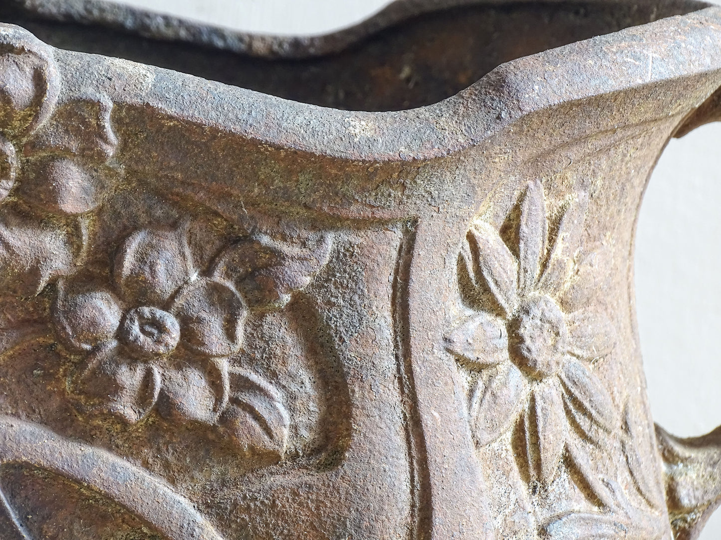 Antique French Art Nouveau planter showing sculpted floral and curved forms.