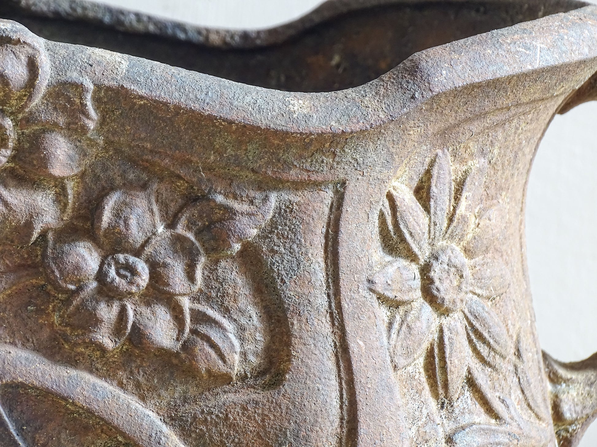 Antique French Art Nouveau planter showing sculpted floral and curved forms.