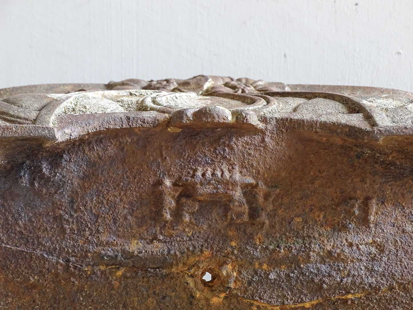 Detail of floral relief design on an Art Nouveau cast iron planter from France.