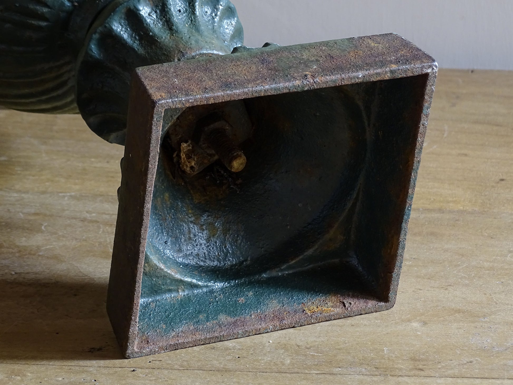 Antique cast iron campana garden urn with weathered green patina