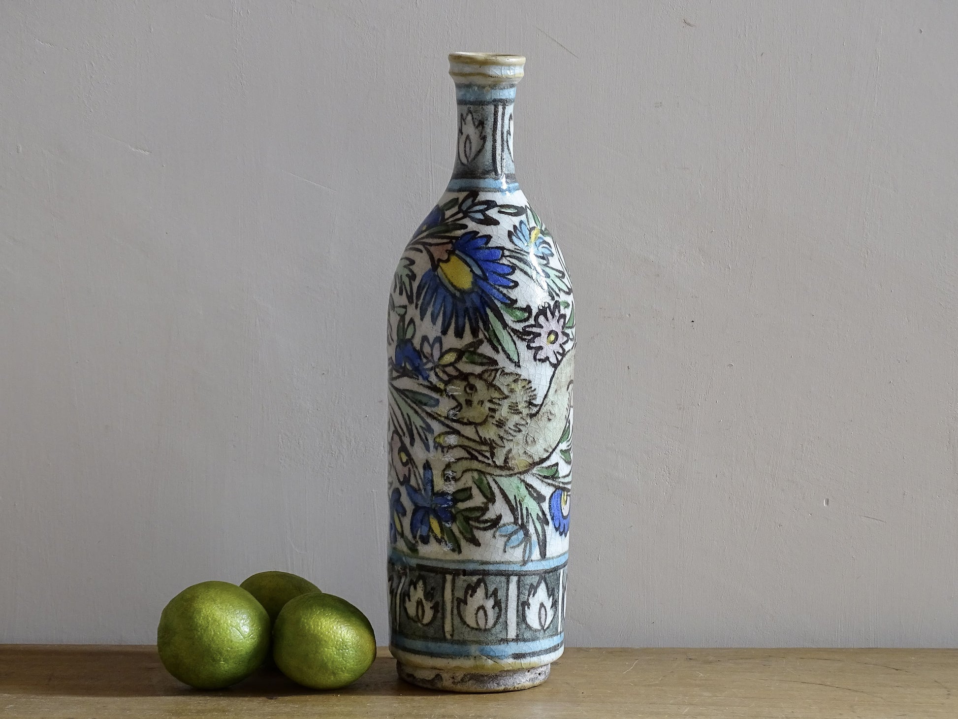 Ottoman revival ceramic bottle with cobalt blue and green floral motifs.