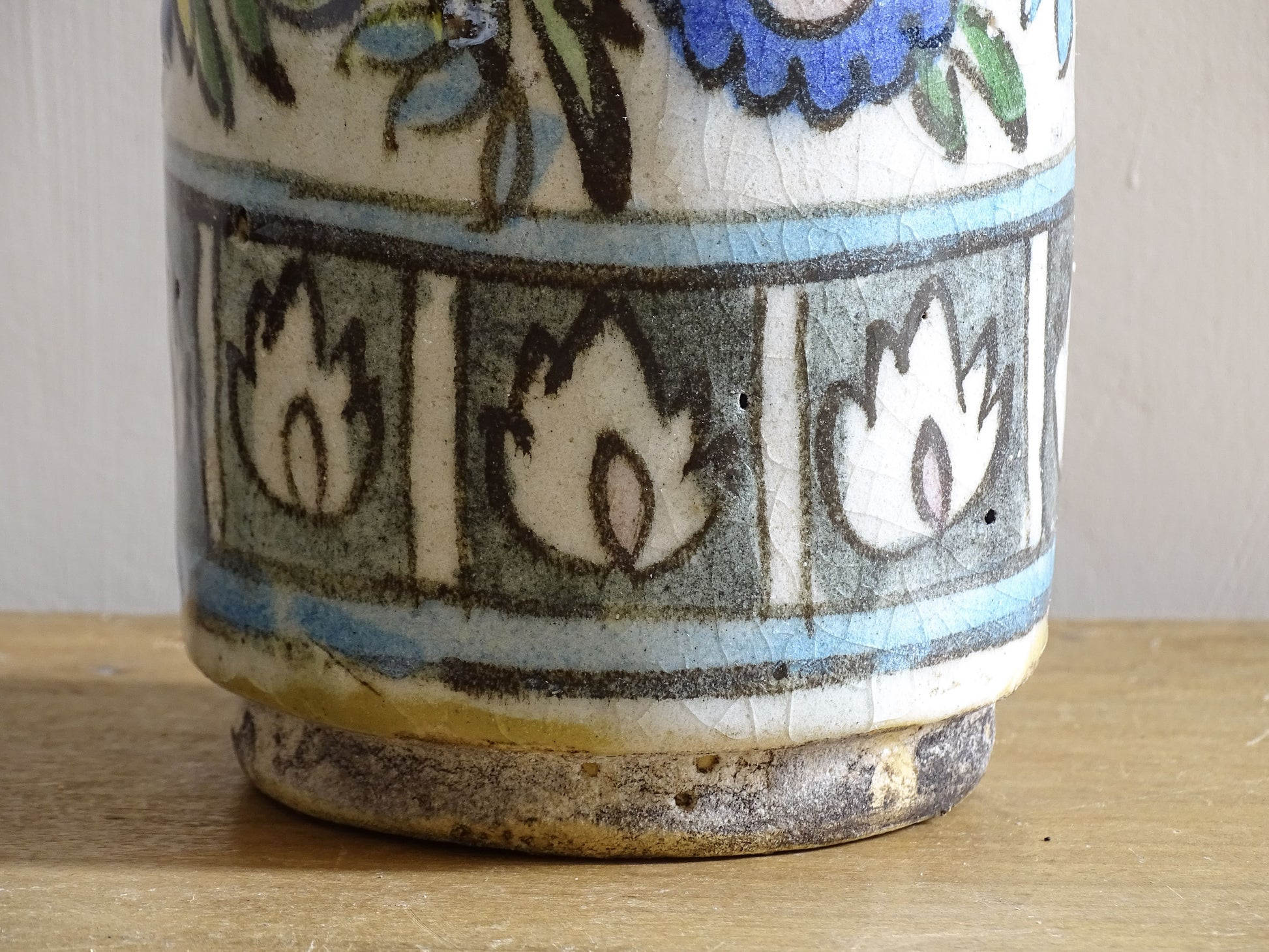 Antique pottery bottle with traditional Ottoman floral and animal motifs.