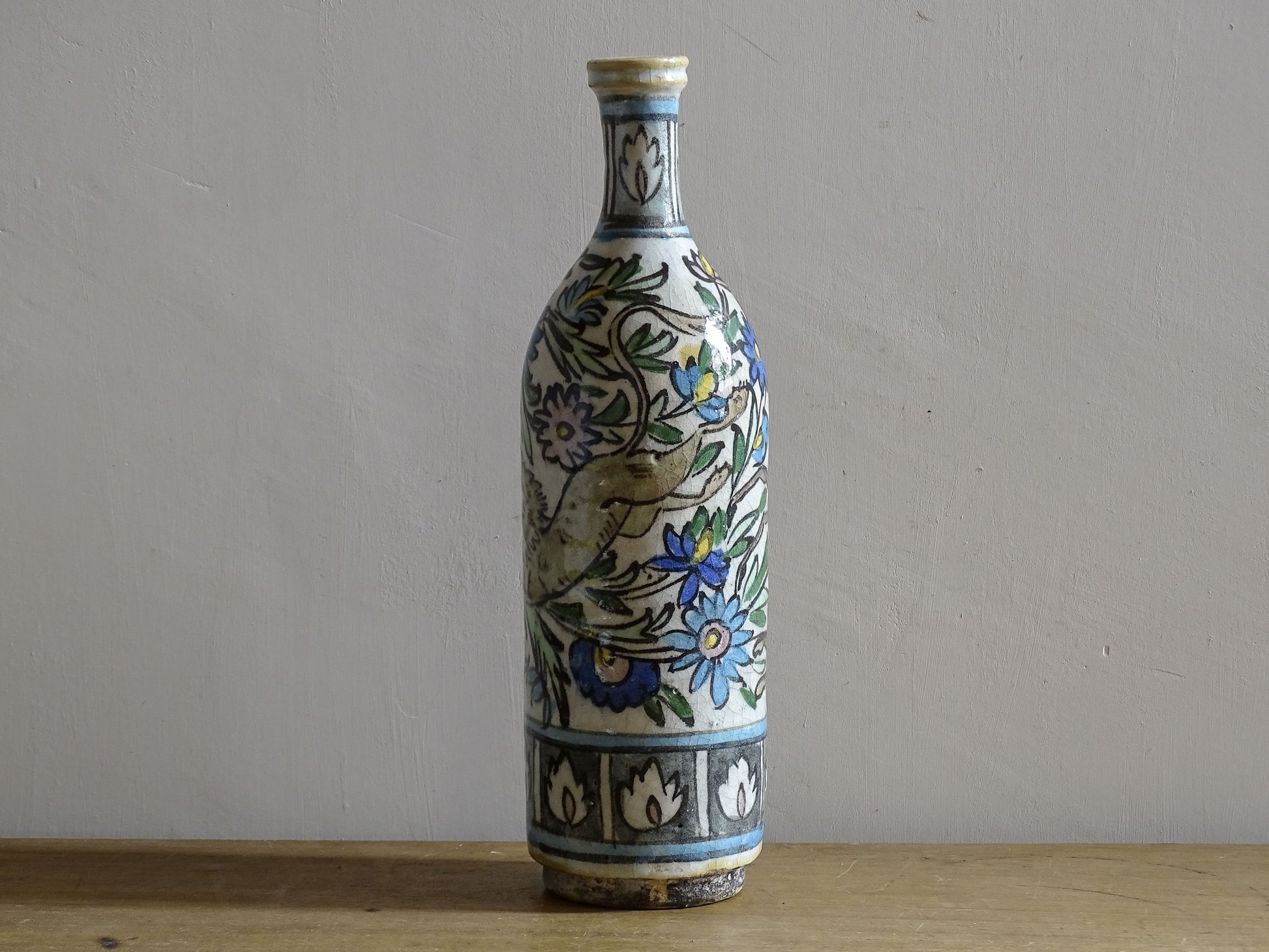 Late 19th century Iznik style ceramic vase with colourful underglaze decoration.