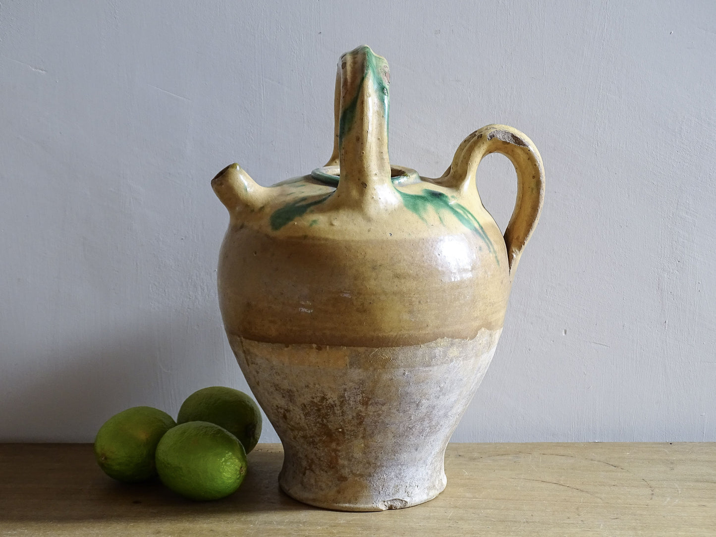 Antique French ceramic gargoulette jug with yellow and green glaze