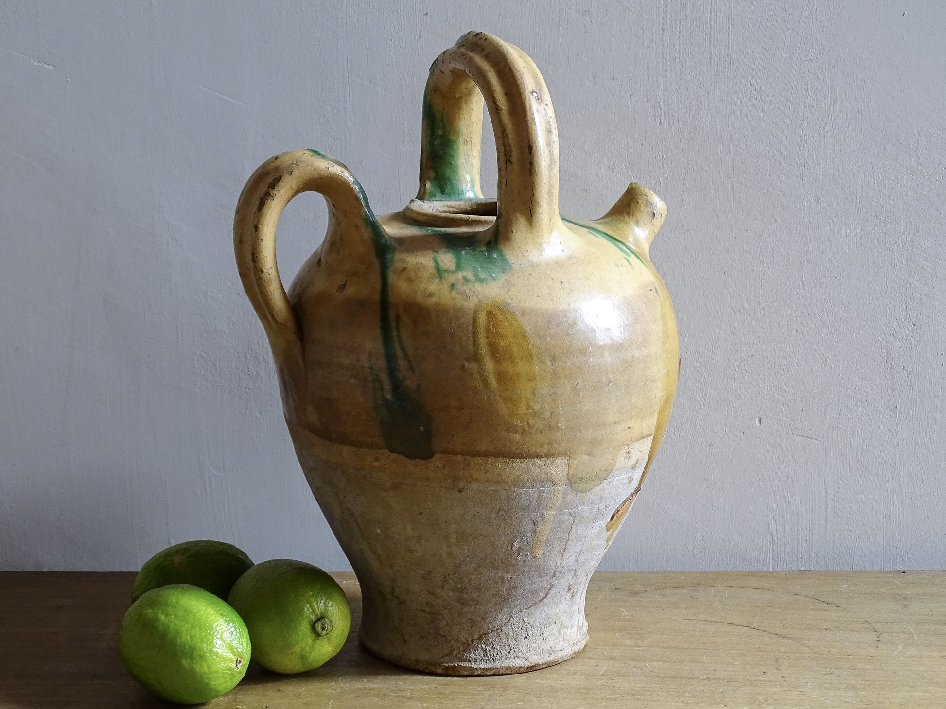 Antique French pottery water jug from Provence with central handle