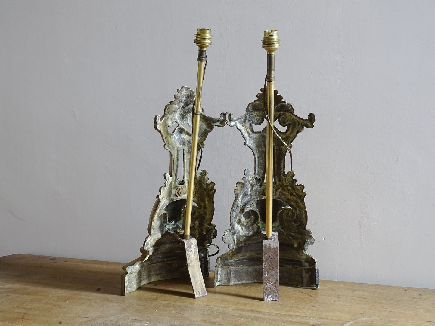 Pair of decorative brass lamp bases with classical mask detail