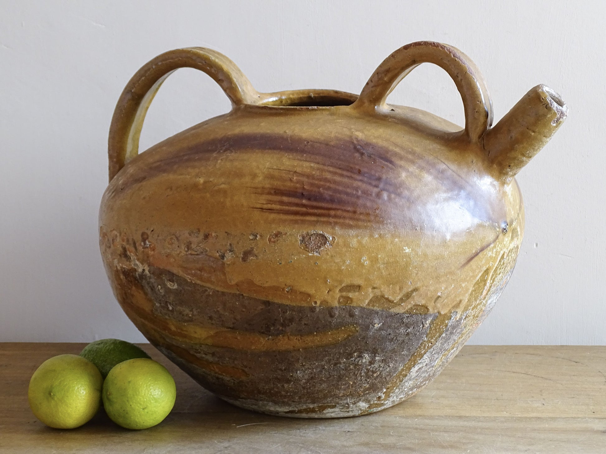 A beautiful French antique ceramic water jug or dourne from the South West region of France. This softly glazed, sculptural terracotta pot dates to the 1900,s.