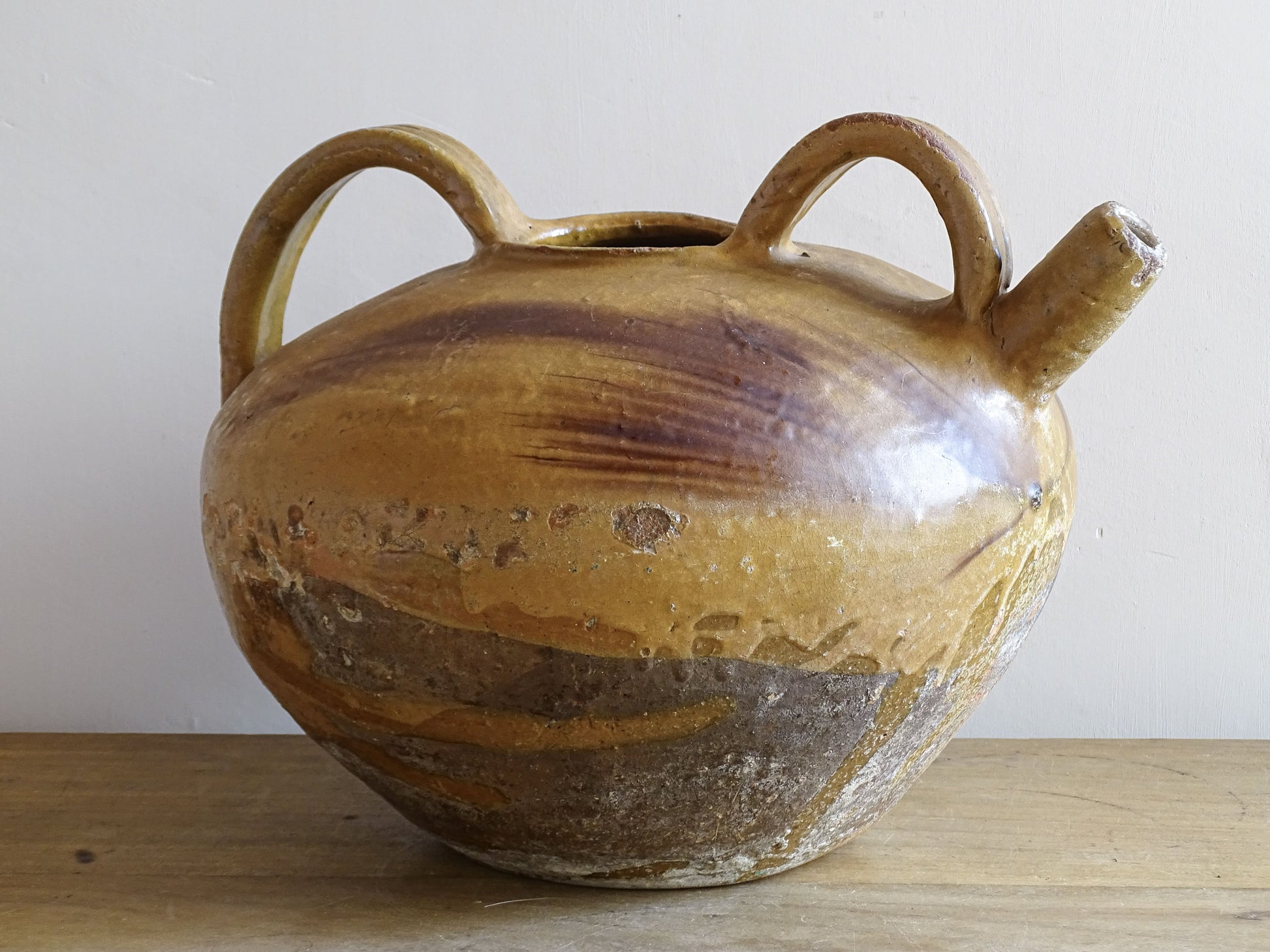 A beautiful French antique ceramic water jug or dourne from the South West region of France. This softly glazed, sculptural terracotta pot dates to the 1900,s.