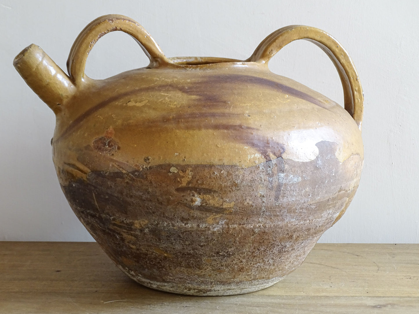 A beautiful French antique ceramic water jug or dourne from the South West region of France. This softly glazed, sculptural terracotta pot dates to the 1900,s.