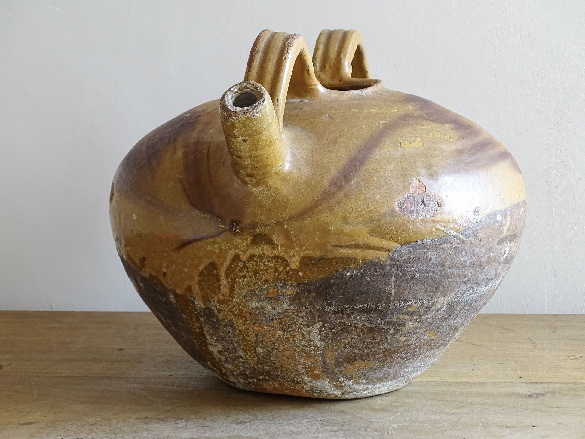 A beautiful French antique ceramic water jug or dourne from the South West region of France. This softly glazed, sculptural terracotta pot dates to the 1900,s.