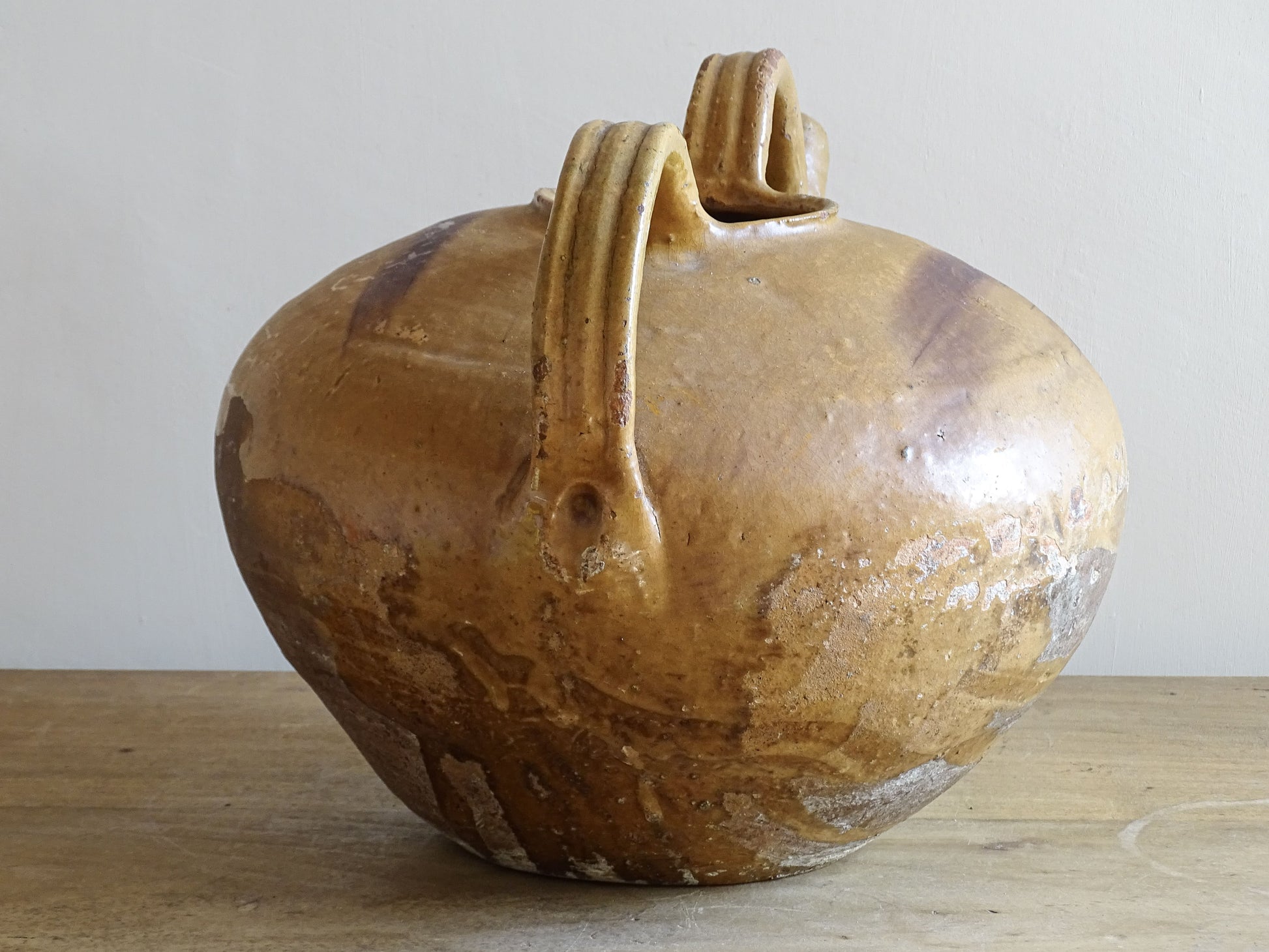 A beautiful French antique ceramic water jug or dourne from the South West region of France. This softly glazed, sculptural terracotta pot dates to the 1900,s.
