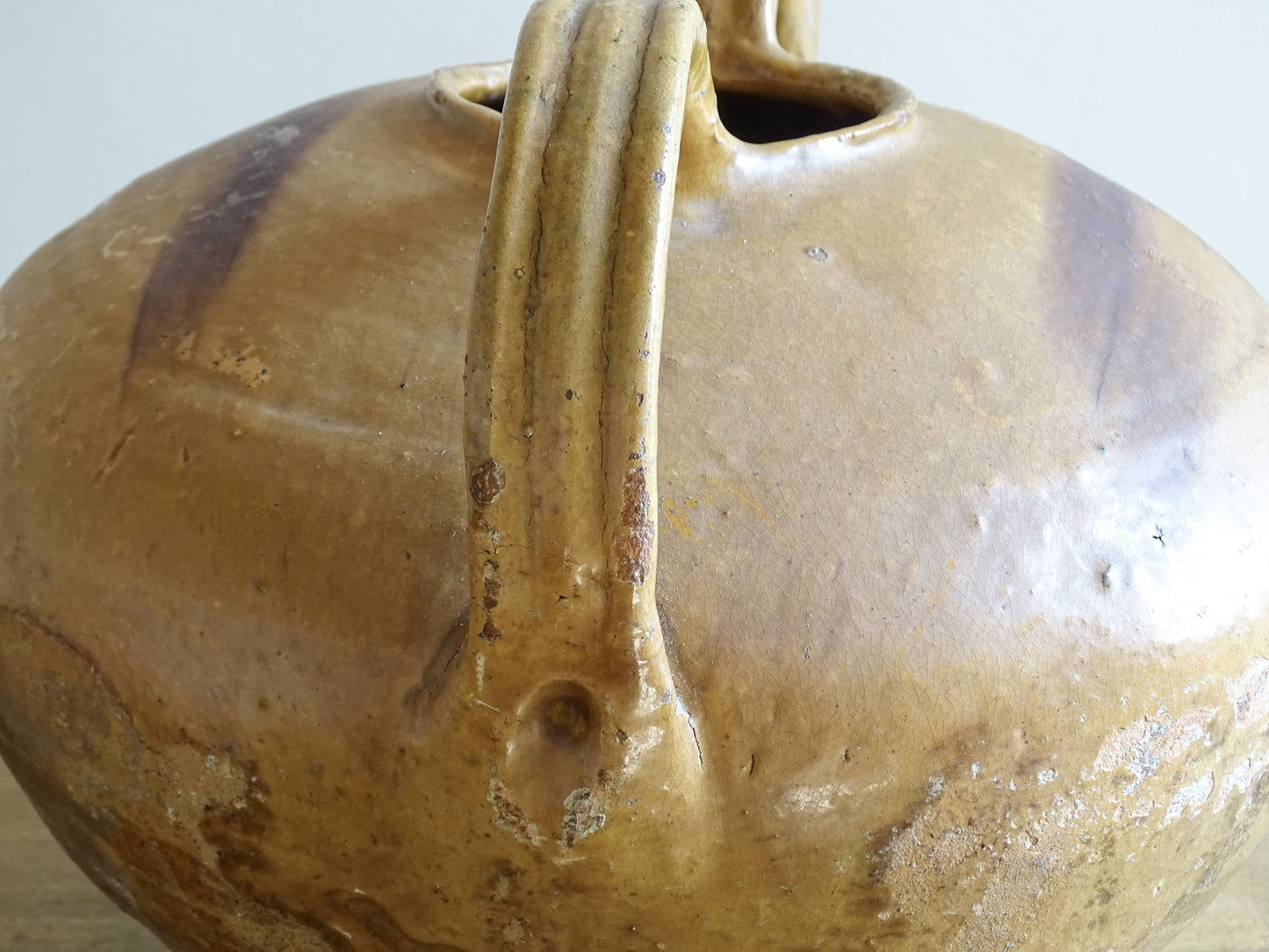 A beautiful French antique ceramic water jug or dourne from the South West region of France. This softly glazed, sculptural terracotta pot dates to the 1900,s.