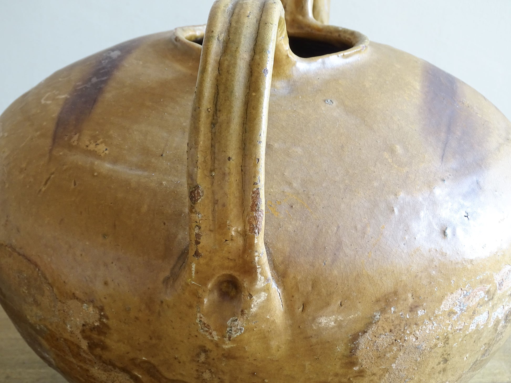 A beautiful French antique ceramic water jug or dourne from the South West region of France. This softly glazed, sculptural terracotta pot dates to the 1900,s.