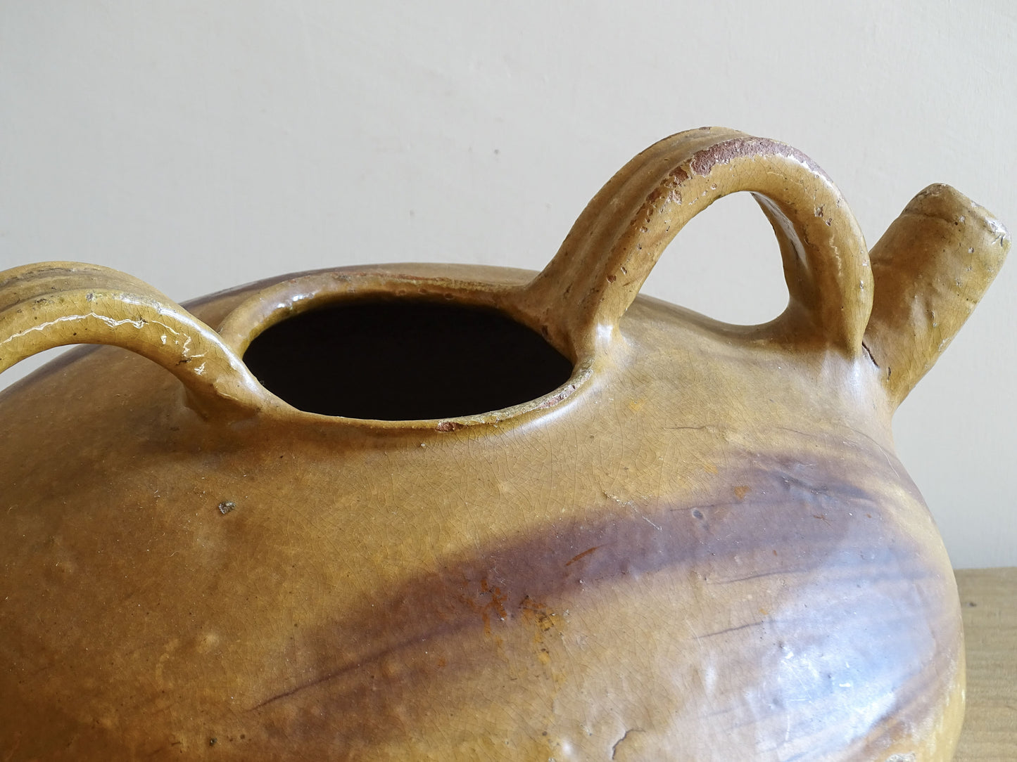 A beautiful French antique ceramic water jug or dourne from the South West region of France. This softly glazed, sculptural terracotta pot dates to the 1900,s.