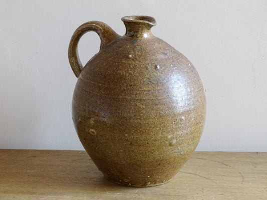 A rustic French antique pottery water or wine pitcher. It has gorgeous warm brown tones. This ceramic jug dates  from the nineteenth century