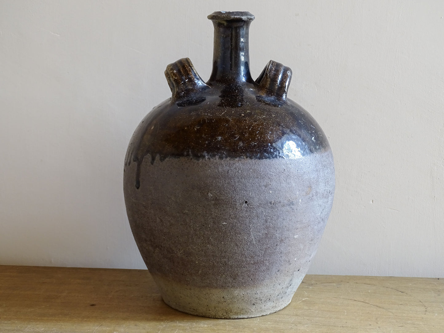 Rustic French earthenware water vessel with dark glaze finish
