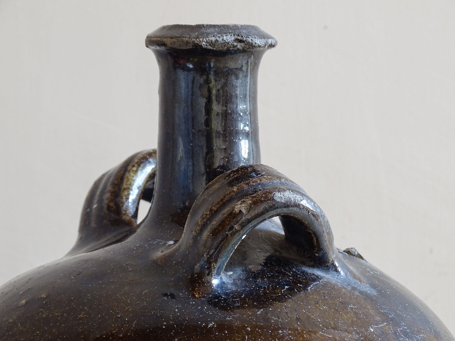 Sculptural French antique jug with two handles and rounded form