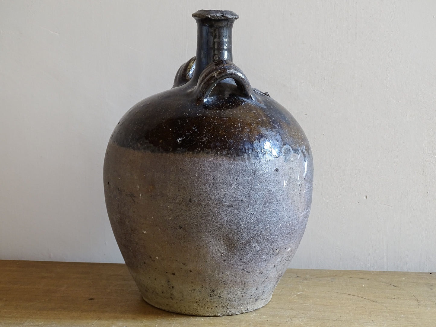 French country pottery cruche with glossy glaze and raw clay base