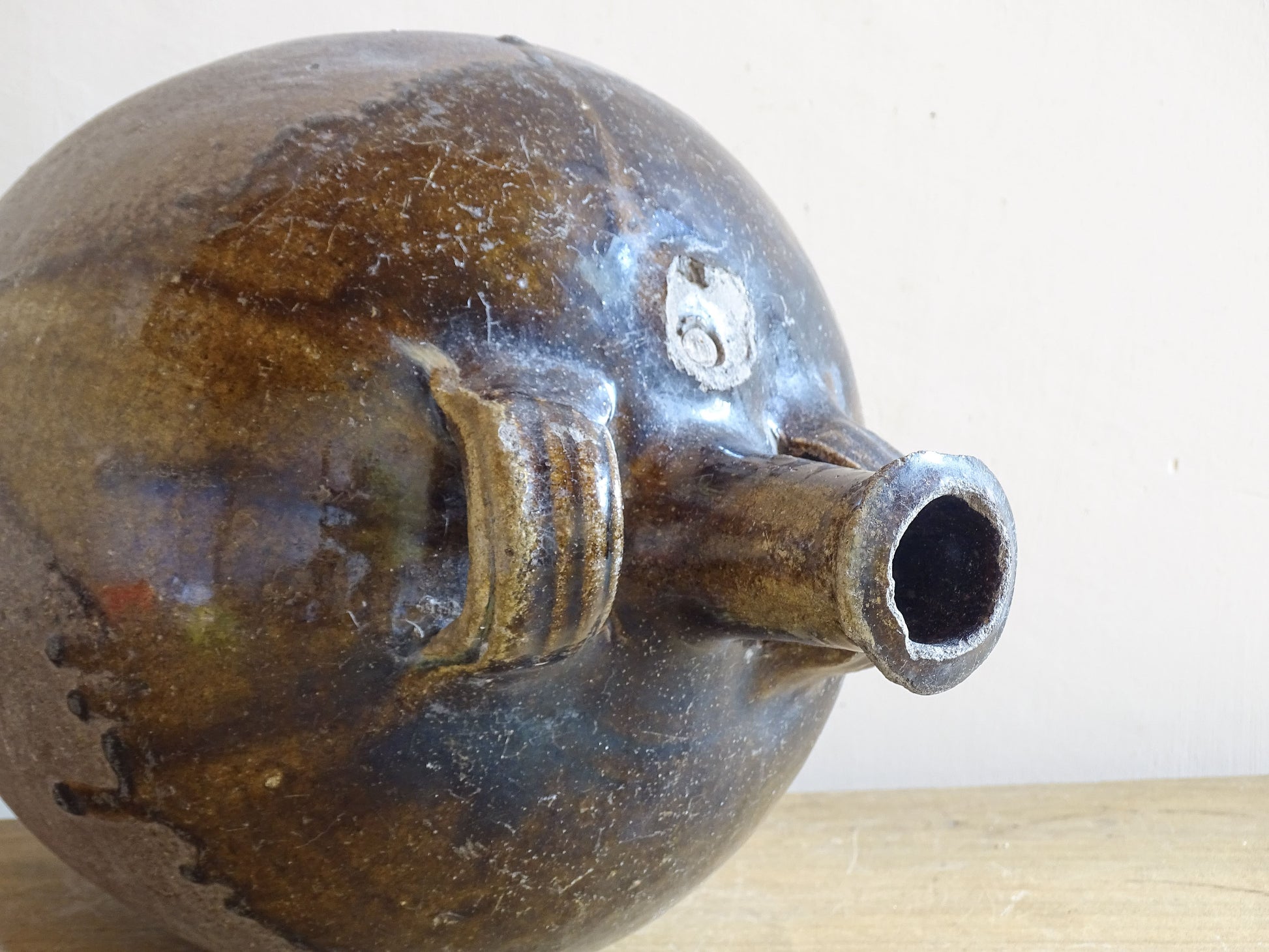 Antique terracotta water jug from France with aged surface