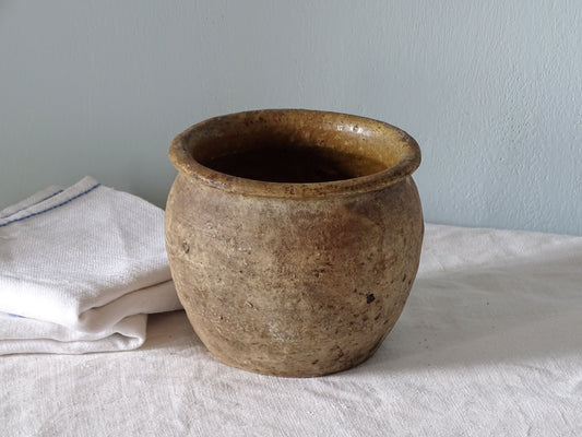 French antique earthenware pot with yellow glaze interior