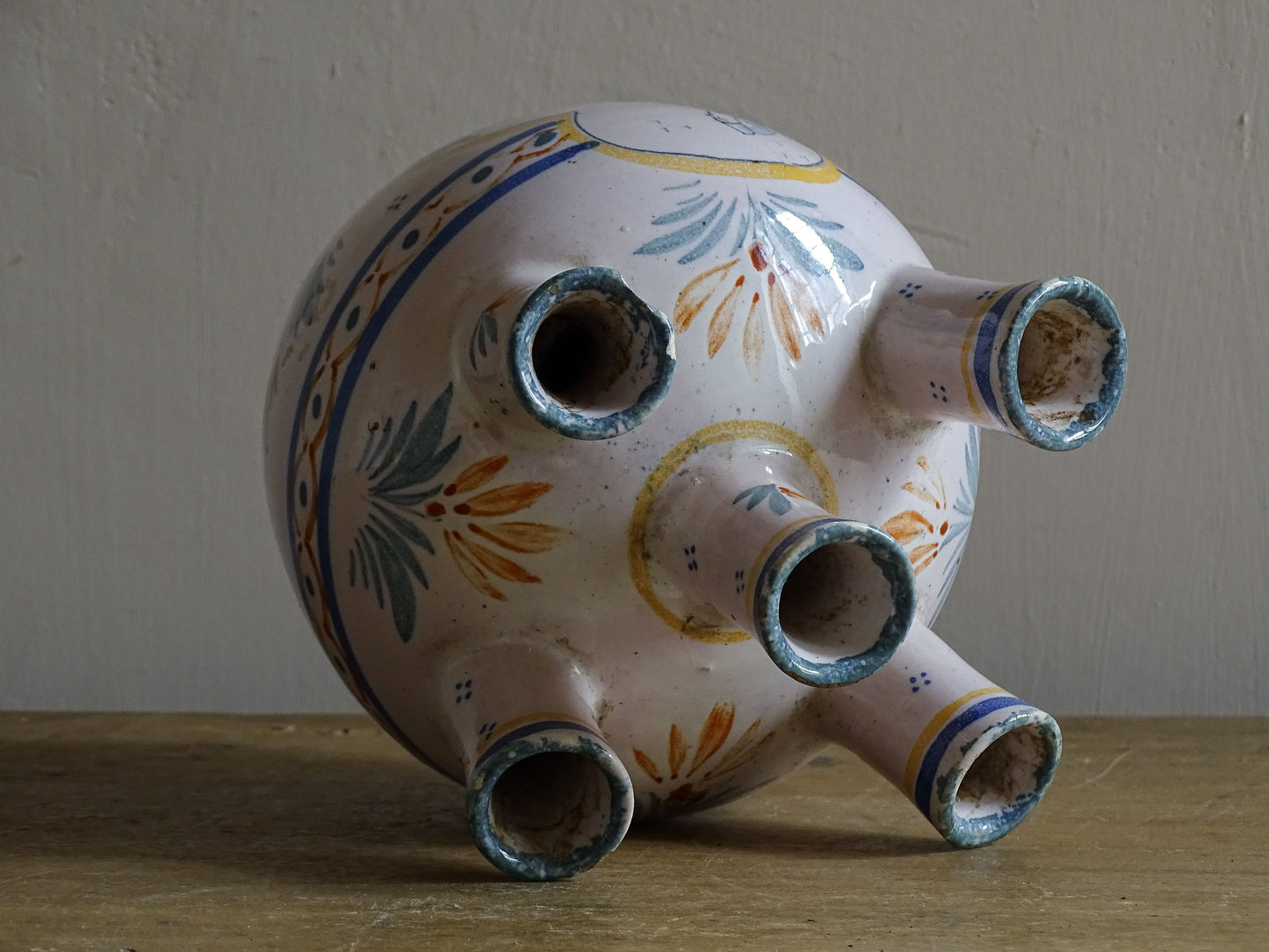 A French vintage tulip vase by Henriot Quimper, featuring traditional Breton decoration and hand-painted detail.