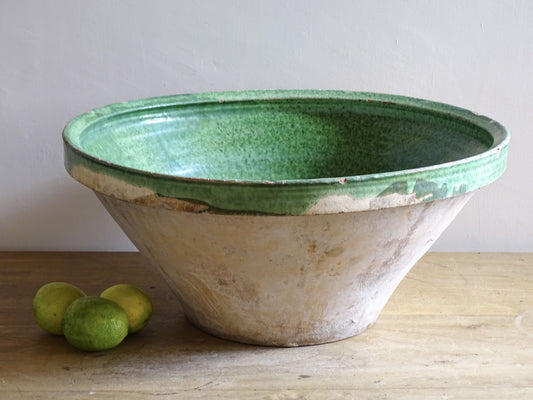 A large antique French tian bowl with a deep green glazed interior, hand-thrown in terracotta. Dating to the late 19th to early 20th century.