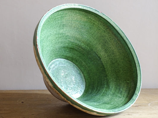 A large antique French tian bowl with a deep green glazed interior, hand-thrown in terracotta. Dating to the late 19th to early 20th century.