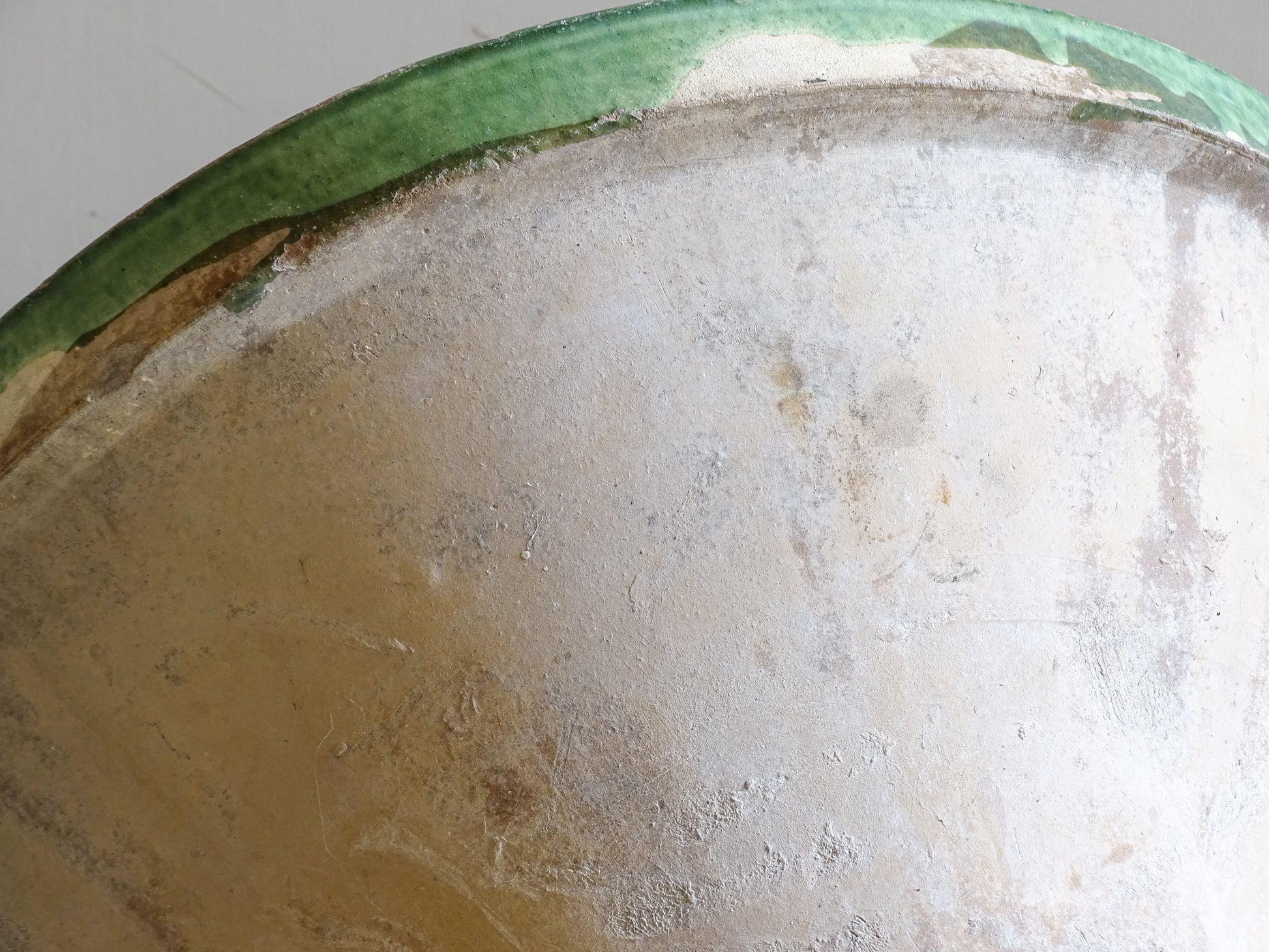 A large antique French tian bowl with a deep green glazed interior, hand-thrown in terracotta. Dating to the late 19th to early 20th century.