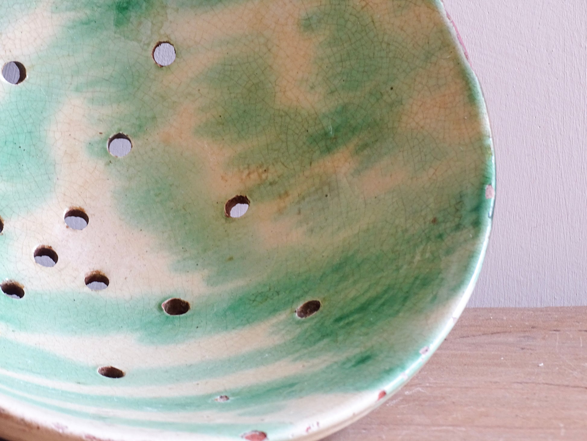 Vintage French ceramic sieve bowl with green and yellow glaze
