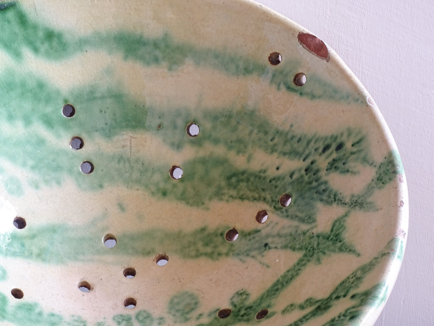 Vintage French ceramic draining bowl in green glazed earthenware