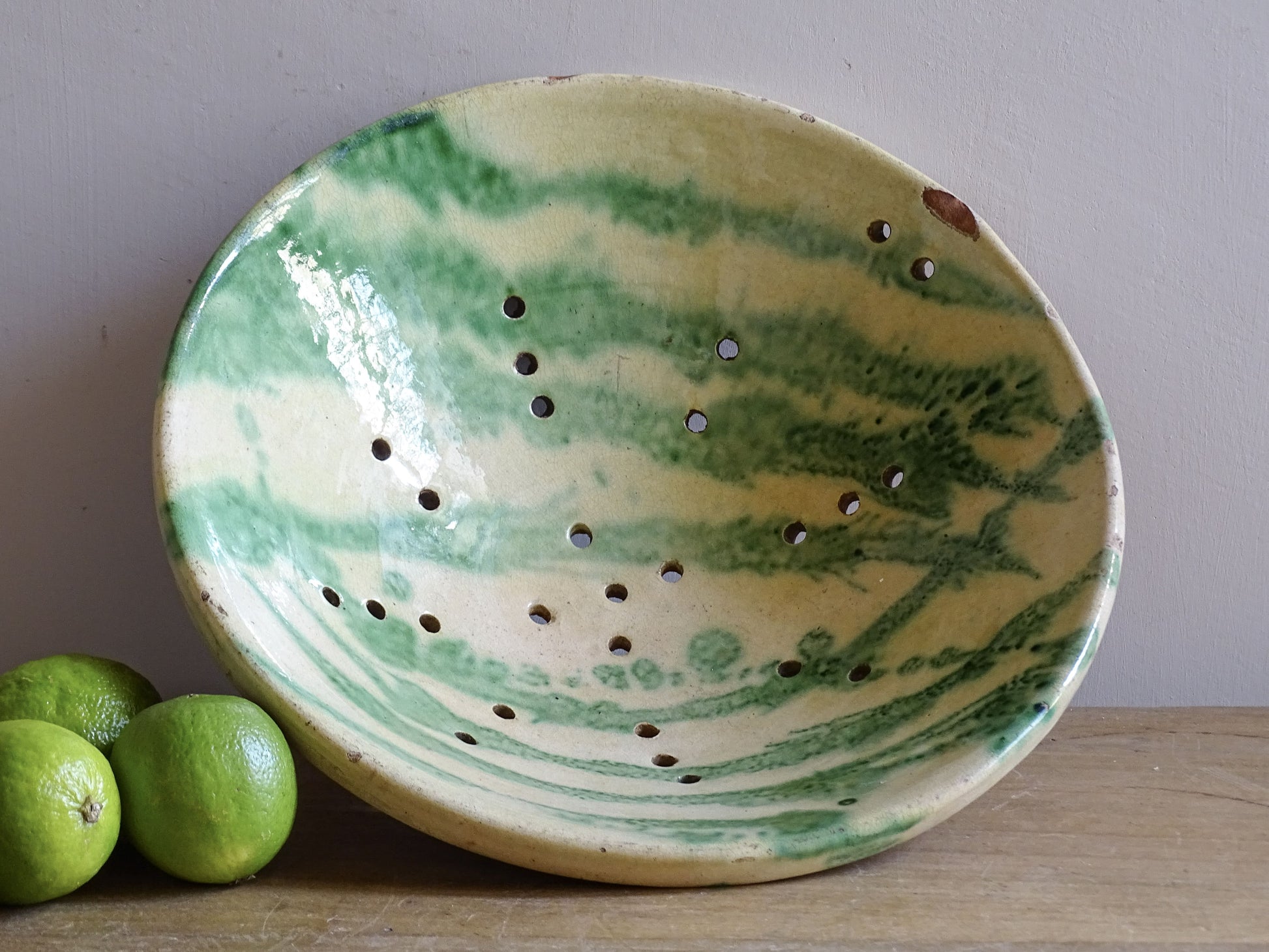French vintage ceramic strainer bowl with green and yellow glaze