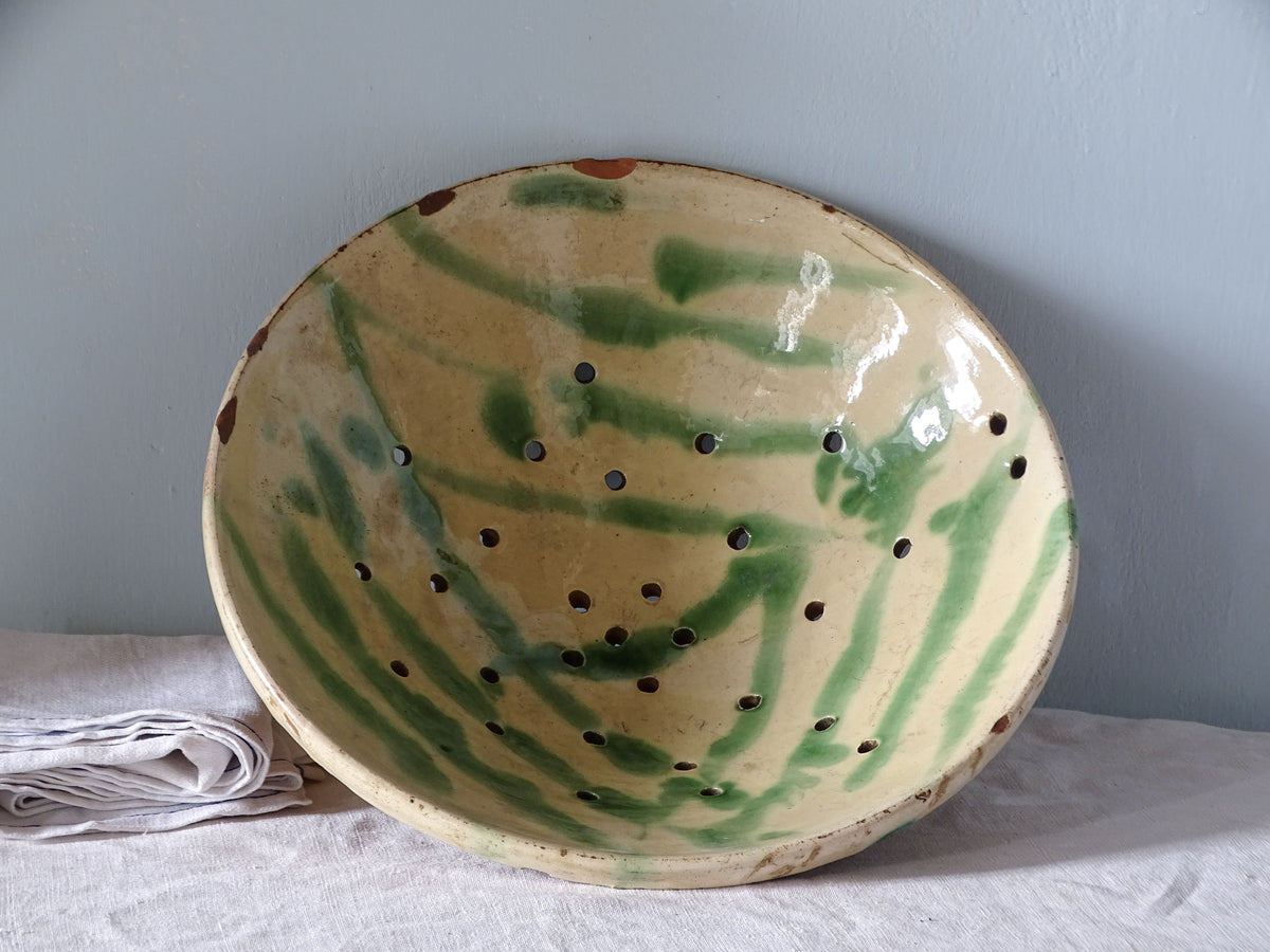 French vintage ceramic colander with yellow and green glaze. 