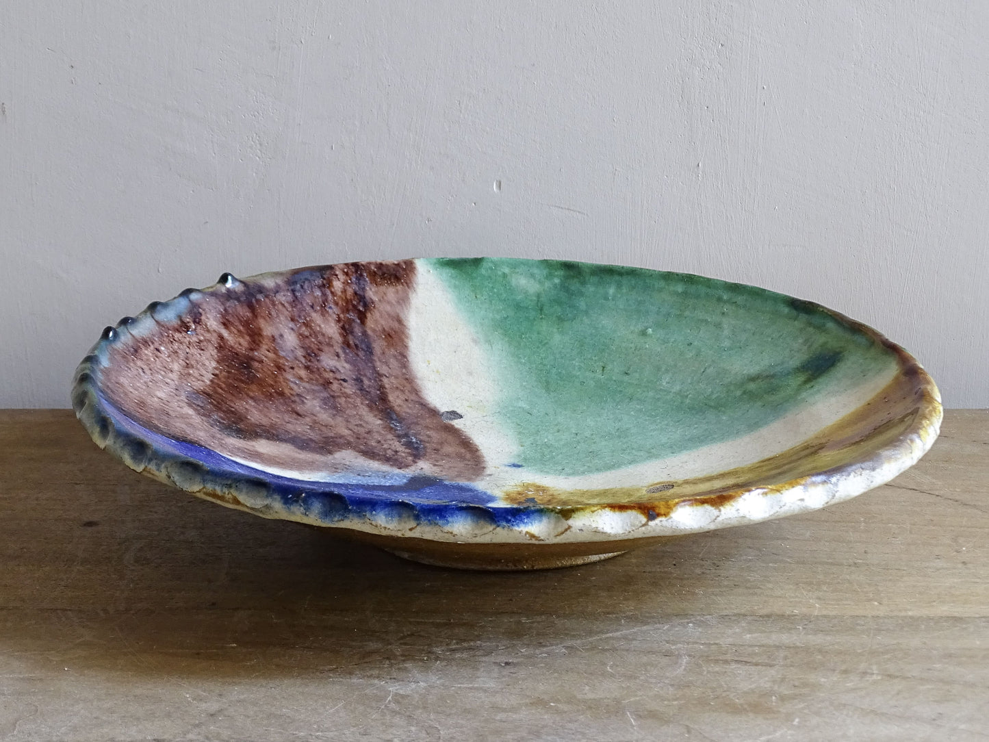 French studio pottery dish with bold multicolour decoration