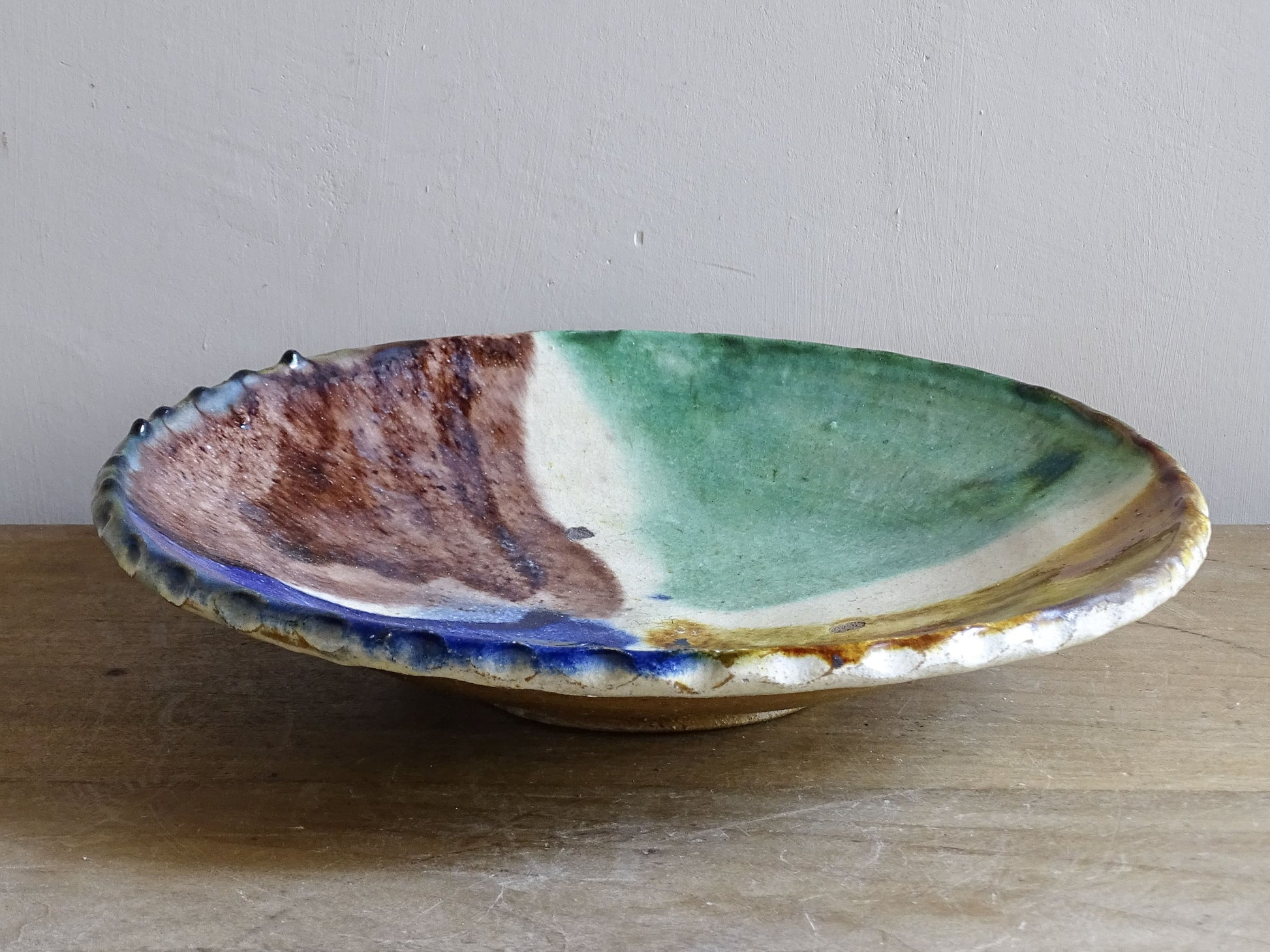 French studio pottery dish with bold multicolour decoration