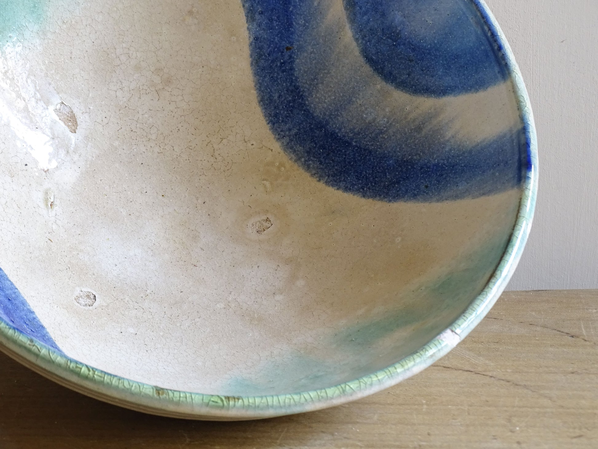 Hand thrown pottery bowl with blue and turquoise interior glaze
